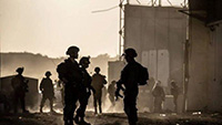 Tentara Israel dikerahkan di perbatasan Erez dengan senjata berat dan kendaraan militer di Erez, Israel pada 29 Februari 2024. Amerika Serikat (AS) untuk pertama kalinya hentikan pengiriman senjata ke Israel. Israel disebut ketar-ketir./ TRIBUNNEWS.COM/Anadolu Agency